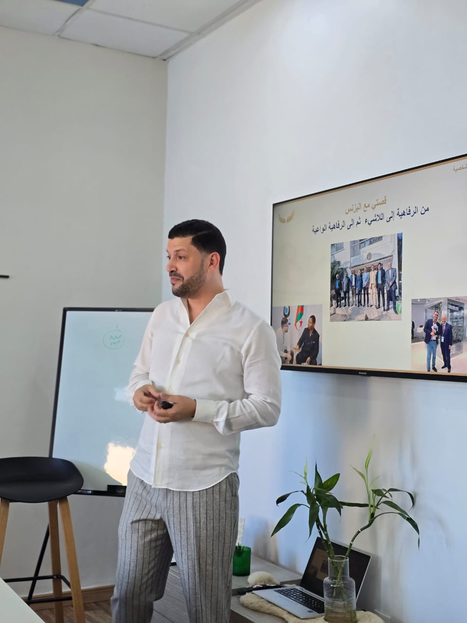 El Hassen speaking on stage